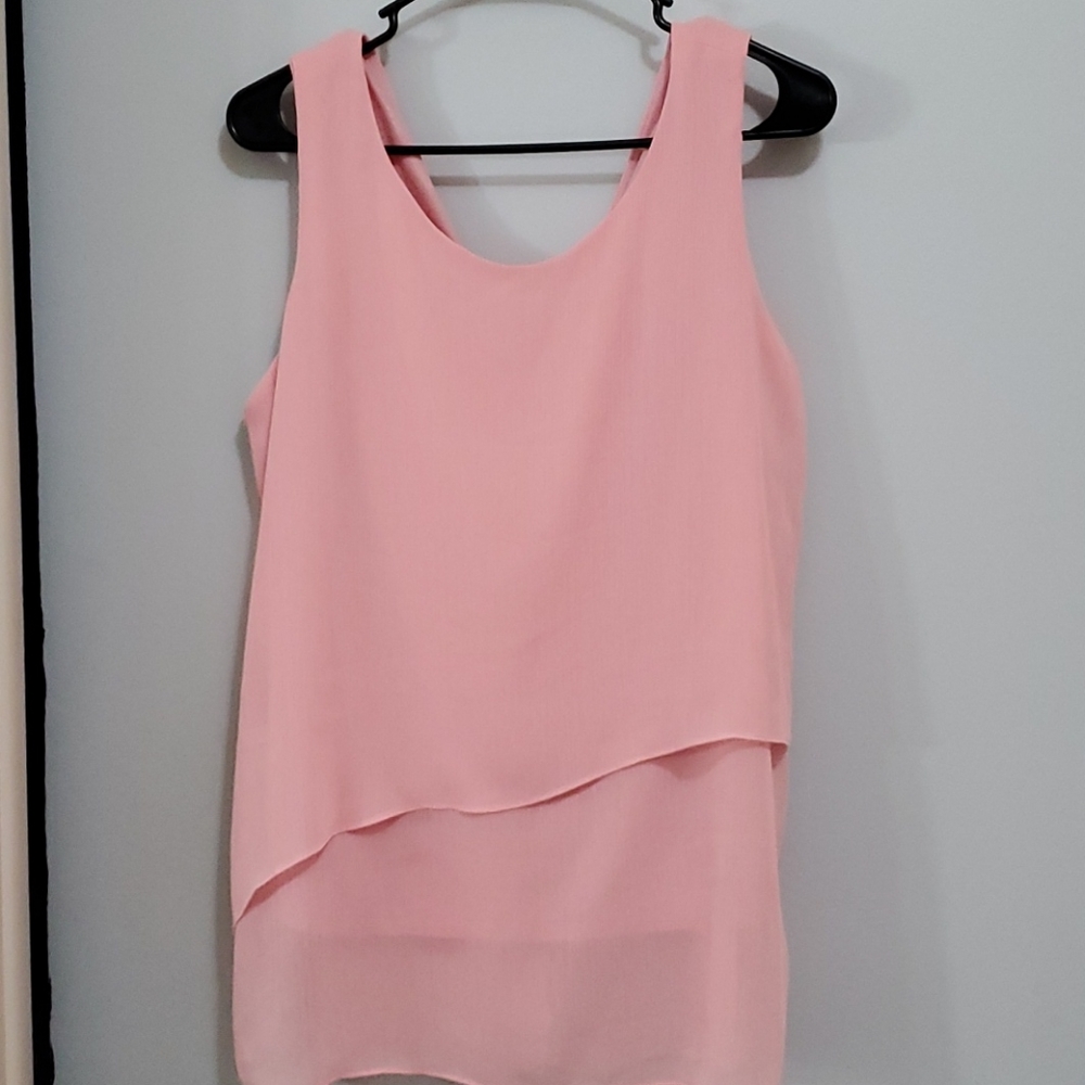 Peach colored top.